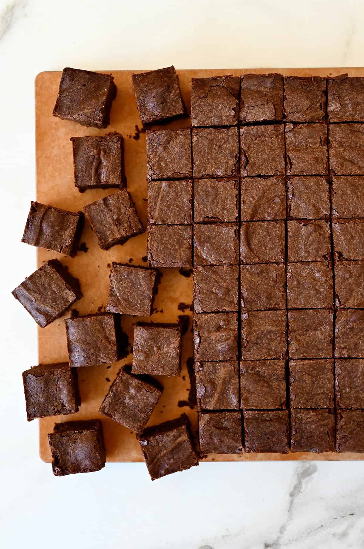 Brownie chunks on a cutting board.